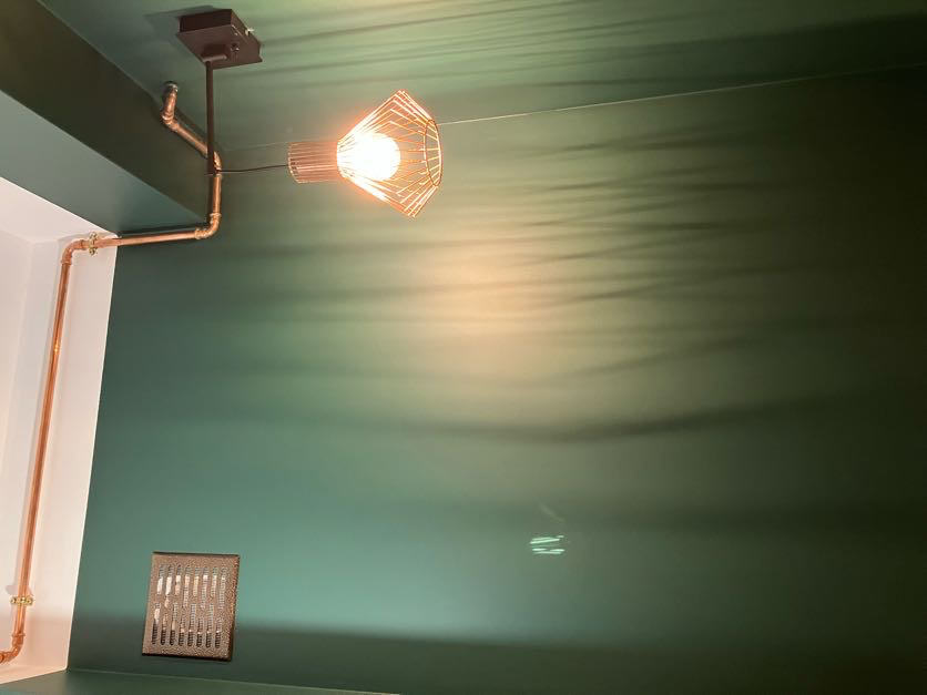 Zabudowa pralki w zielonej łazience